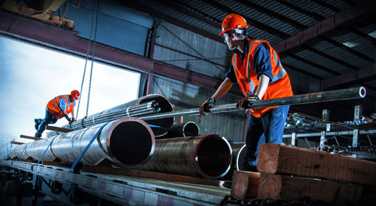 Man Working in Pipe Factory